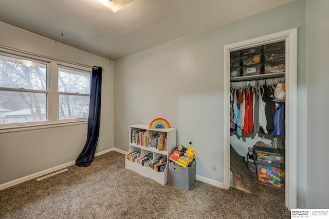 playroom featuring carpet floors, visible vents, and baseboards