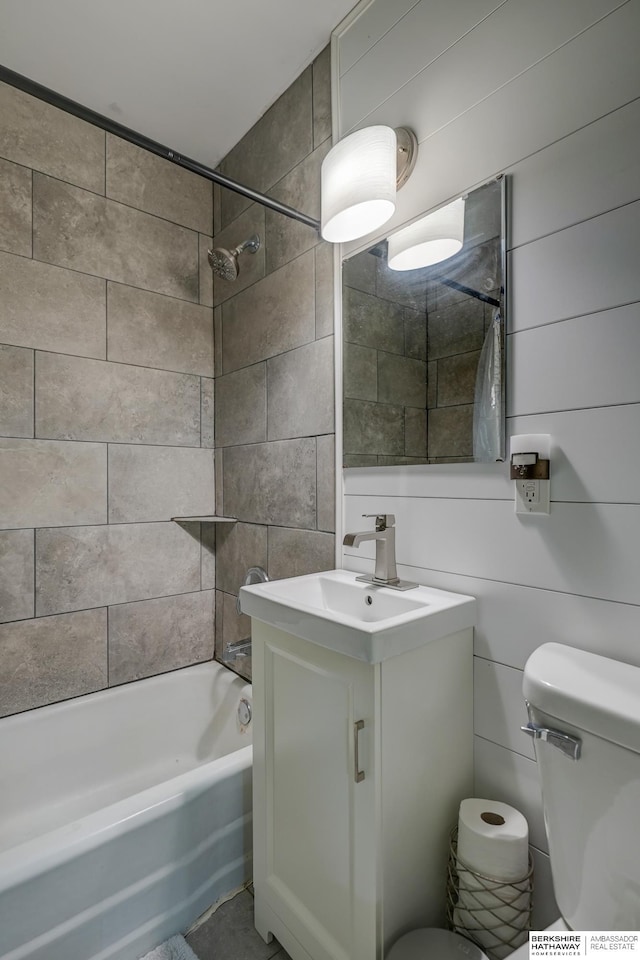 full bathroom featuring toilet, shower / bath combination, and vanity