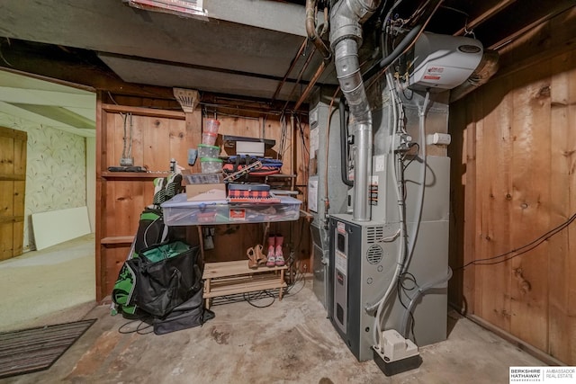 unfinished basement featuring heating unit