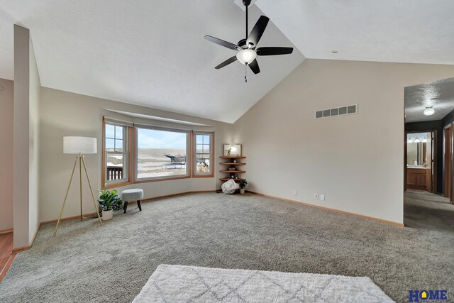 unfurnished room featuring high vaulted ceiling, carpet, visible vents, and baseboards