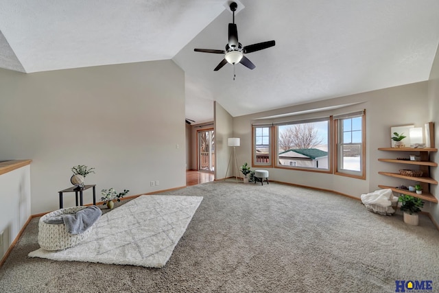 sitting room featuring lofted ceiling, carpet floors, a ceiling fan, and baseboards