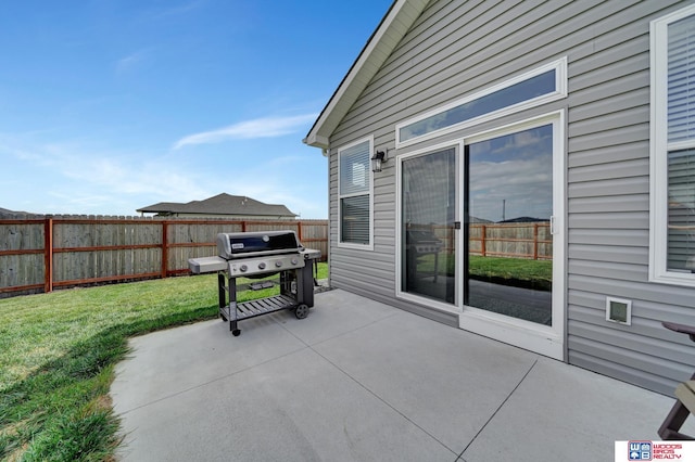 view of patio / terrace featuring fence and grilling area