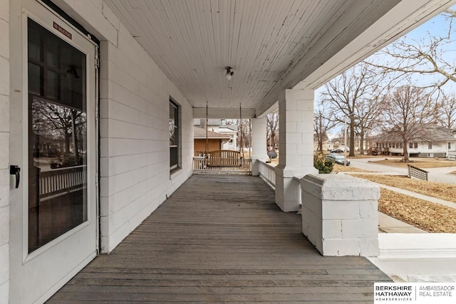 wooden terrace with covered porch