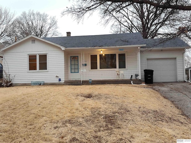 ranch-style house featuring aphalt driveway, a garage, roof with shingles, a front lawn, and a chimney