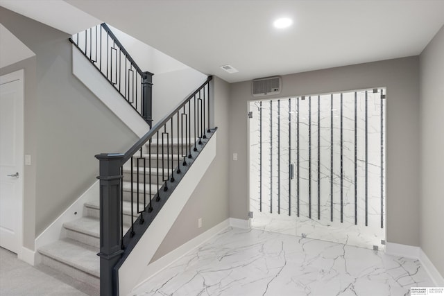 staircase with recessed lighting, marble finish floor, visible vents, and baseboards