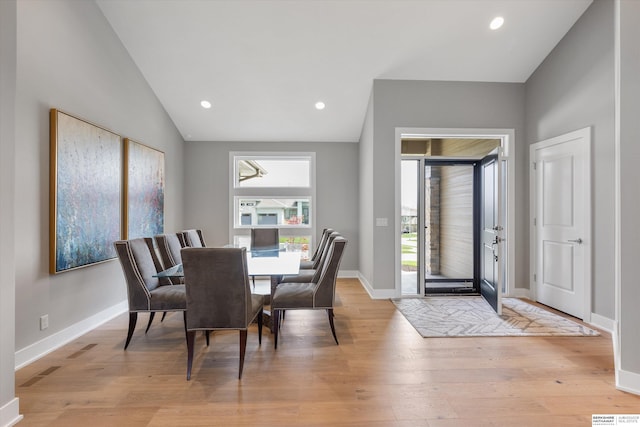 dining area with vaulted ceiling, recessed lighting, baseboards, and light wood-style floors