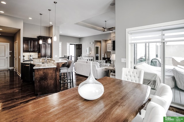 dining area with a ceiling fan, dark wood-type flooring, and recessed lighting