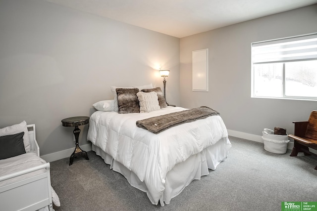 bedroom featuring carpet and baseboards