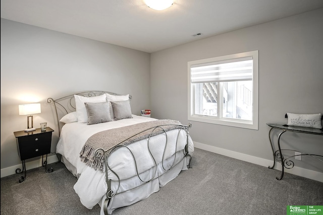 bedroom featuring carpet floors, visible vents, and baseboards