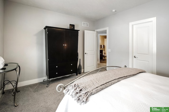 carpeted bedroom with visible vents and baseboards