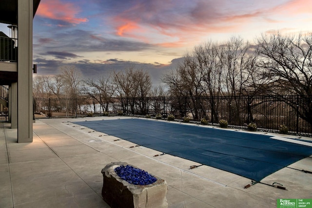 view of swimming pool featuring a fenced in pool, a patio area, and fence