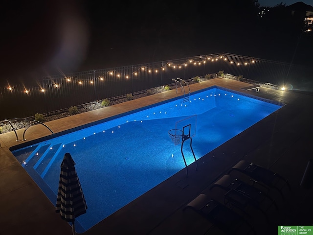 pool at twilight with fence