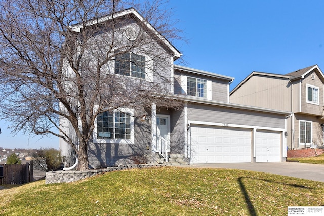 traditional-style house featuring driveway and a front lawn