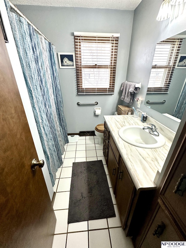 full bath with toilet, a shower with curtain, tile patterned floors, a textured ceiling, and vanity