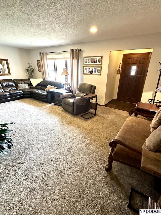 carpeted living room featuring a textured ceiling