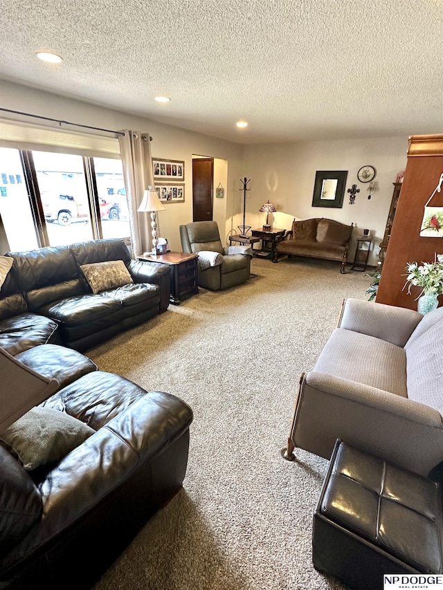 living area with a textured ceiling, carpet, and recessed lighting