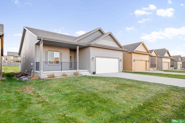 view of front facade featuring a front yard, driveway, and an attached garage