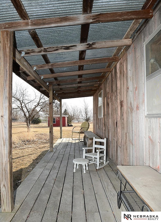 deck with an outdoor structure and a storage unit