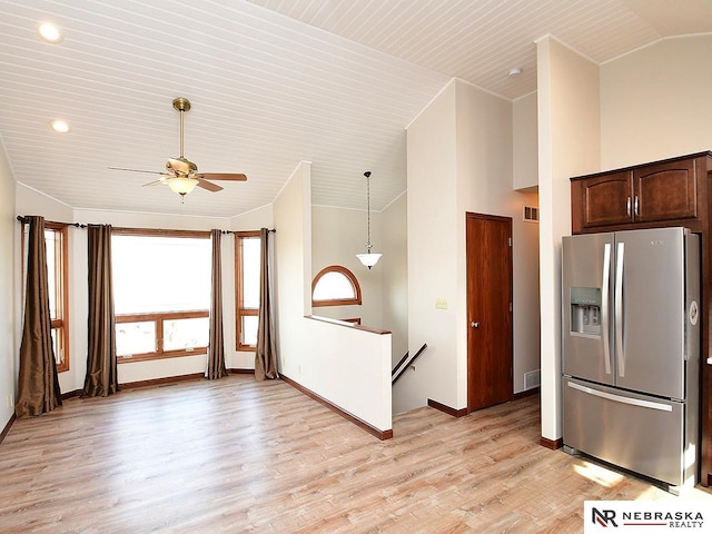 kitchen featuring dark brown cabinetry, visible vents, baseboards, light wood-type flooring, and stainless steel refrigerator with ice dispenser