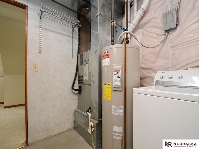 utilities featuring water heater and washer / dryer