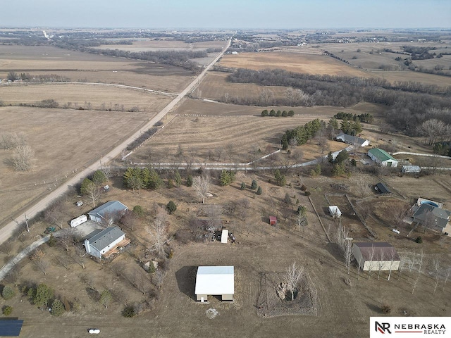 birds eye view of property featuring a rural view