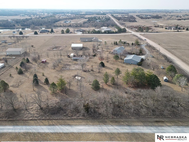 birds eye view of property with a rural view