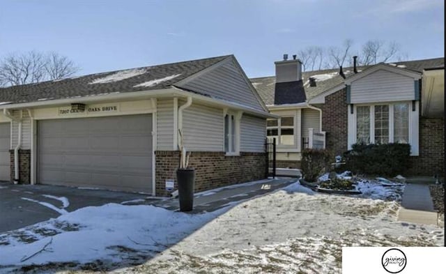 ranch-style house with brick siding and a chimney