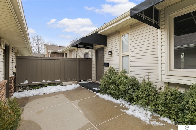 view of home's exterior featuring fence