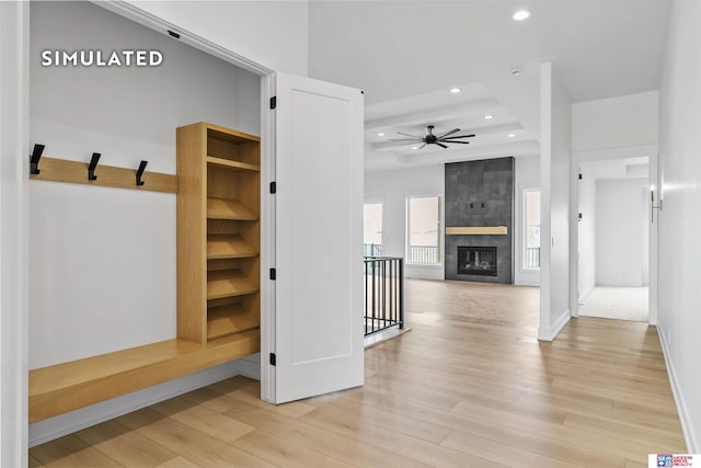 mudroom with baseboards, a tile fireplace, ceiling fan, light wood-style floors, and recessed lighting