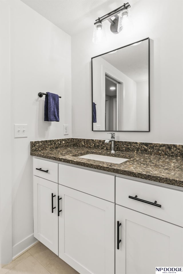 bathroom with tile patterned flooring and vanity