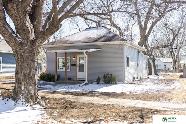 view of front of property with roof with shingles