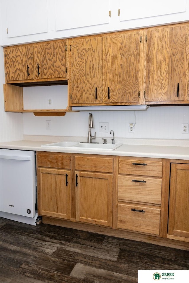 kitchen with a sink, light countertops, dishwasher, open shelves, and dark wood finished floors