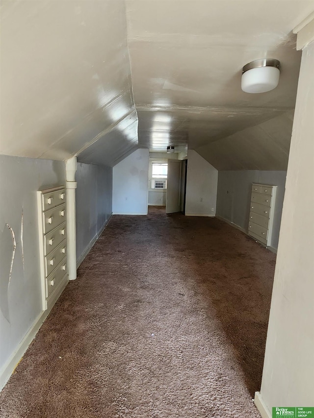 bonus room featuring vaulted ceiling and carpet floors