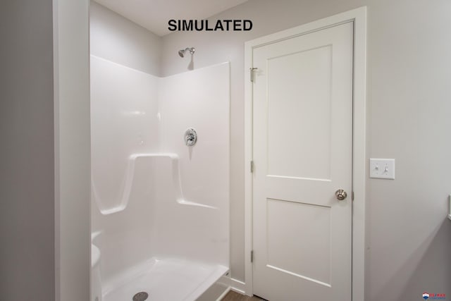 bathroom with a shower stall