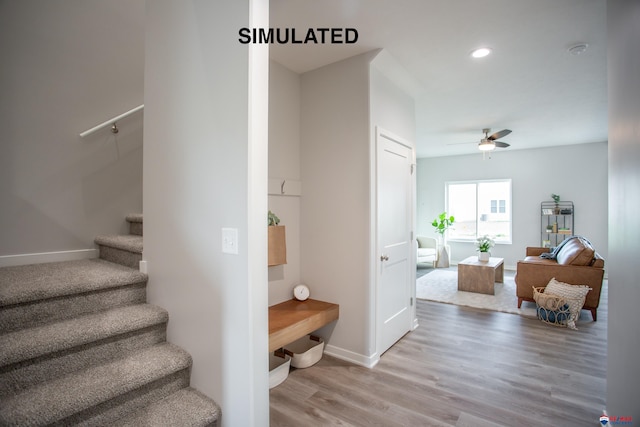 stairway featuring recessed lighting, ceiling fan, baseboards, and wood finished floors