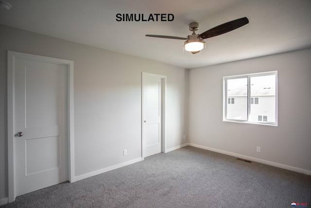 unfurnished bedroom with baseboards, visible vents, ceiling fan, and carpet flooring