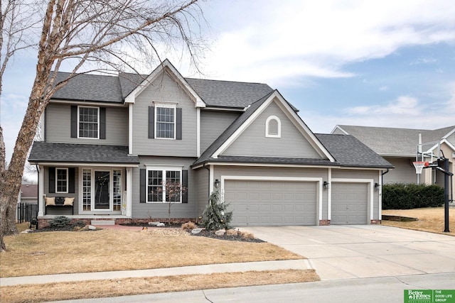 traditional home featuring a garage, a porch, concrete driveway, and roof with shingles