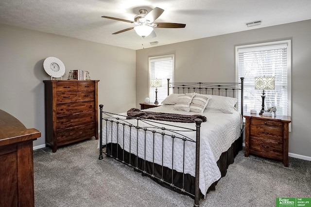 bedroom featuring ceiling fan, carpet flooring, visible vents, and baseboards