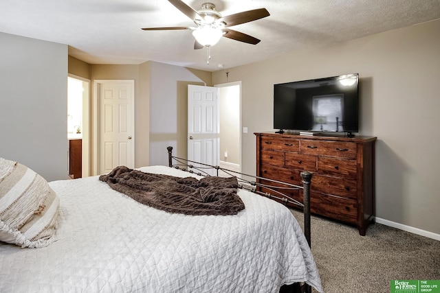 carpeted bedroom with a textured ceiling, baseboards, and a ceiling fan