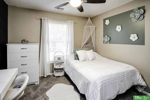 bedroom with ceiling fan, visible vents, and carpet flooring