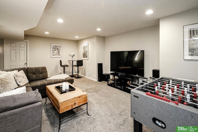 carpeted living room featuring baseboards and recessed lighting