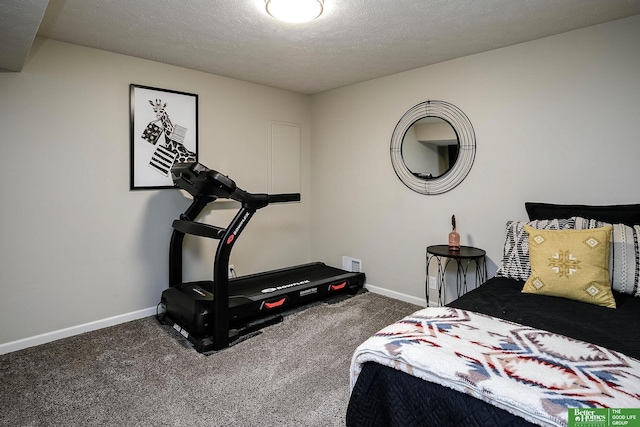 carpeted bedroom with visible vents, baseboards, and a textured ceiling