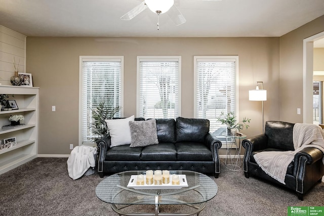 living area with carpet flooring, a ceiling fan, and baseboards