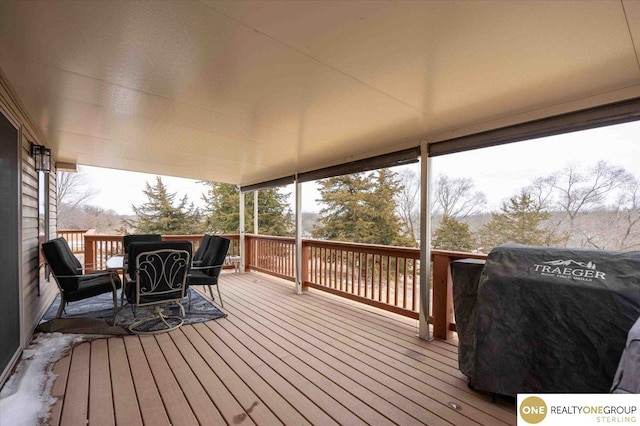 wooden terrace featuring grilling area