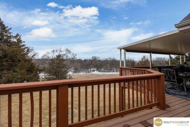 deck featuring a lawn