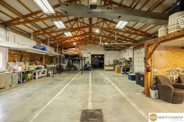 garage with visible vents and a workshop area