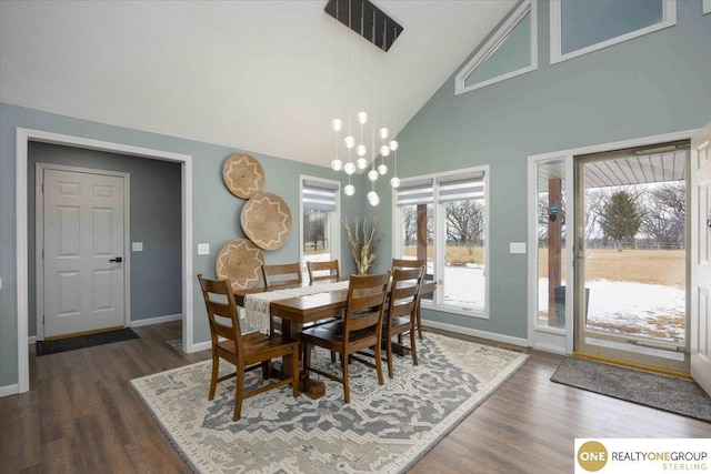 dining room featuring baseboards, dark wood-style floors, visible vents, and a chandelier