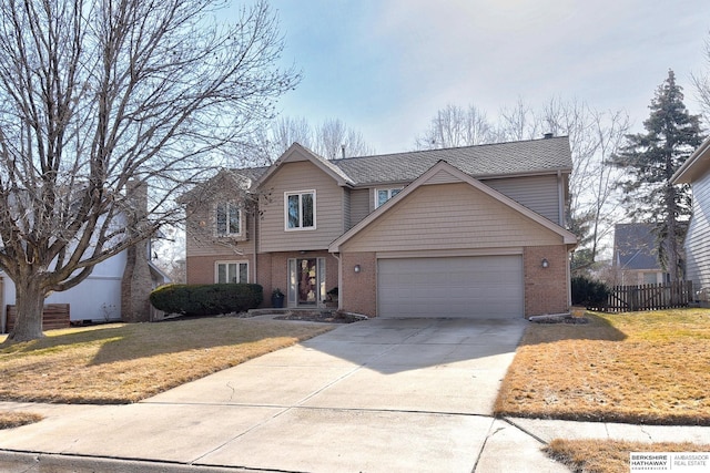 traditional-style home featuring brick siding, concrete driveway, an attached garage, a front yard, and fence