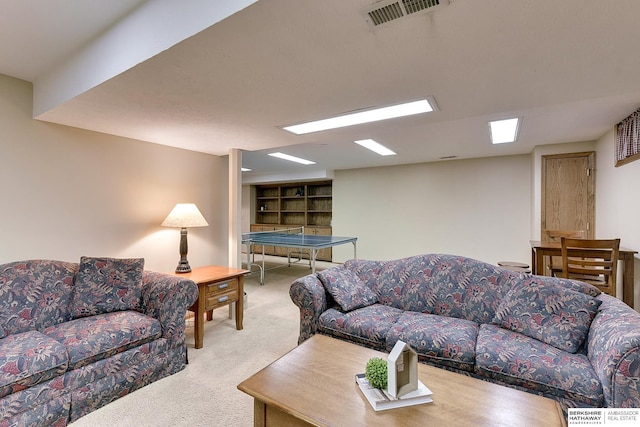 carpeted living area with visible vents