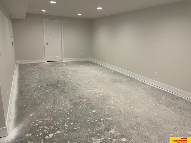 unfurnished room with recessed lighting and baseboards